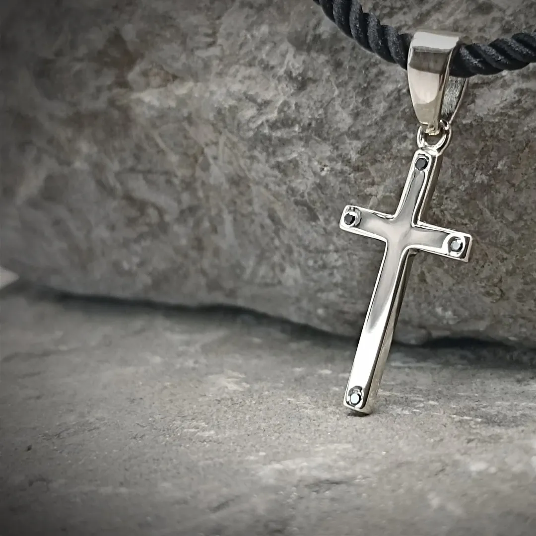 A white gold cross with diamonds
