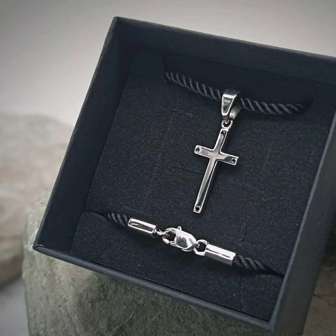 A white gold cross with diamonds