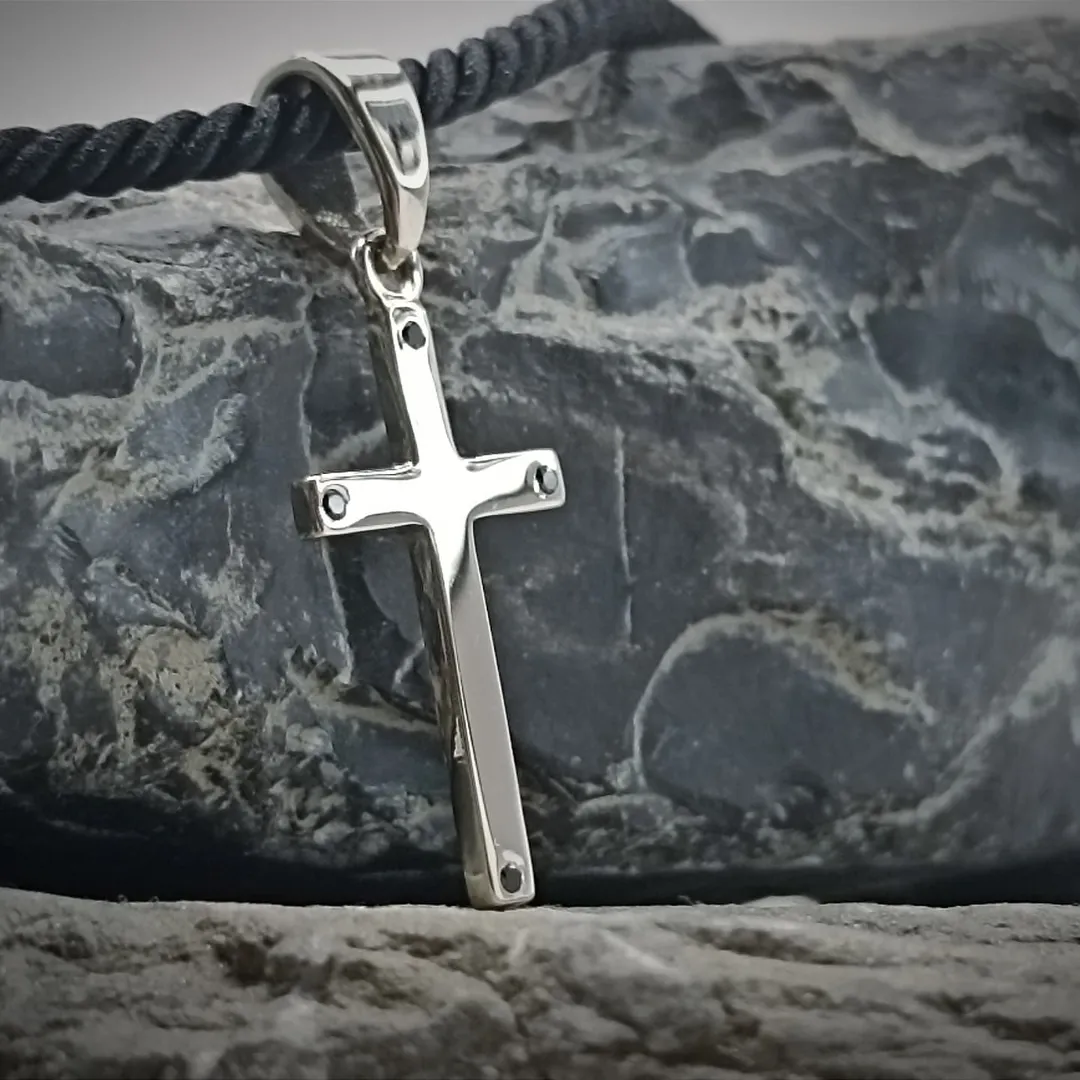 A white gold cross with diamonds