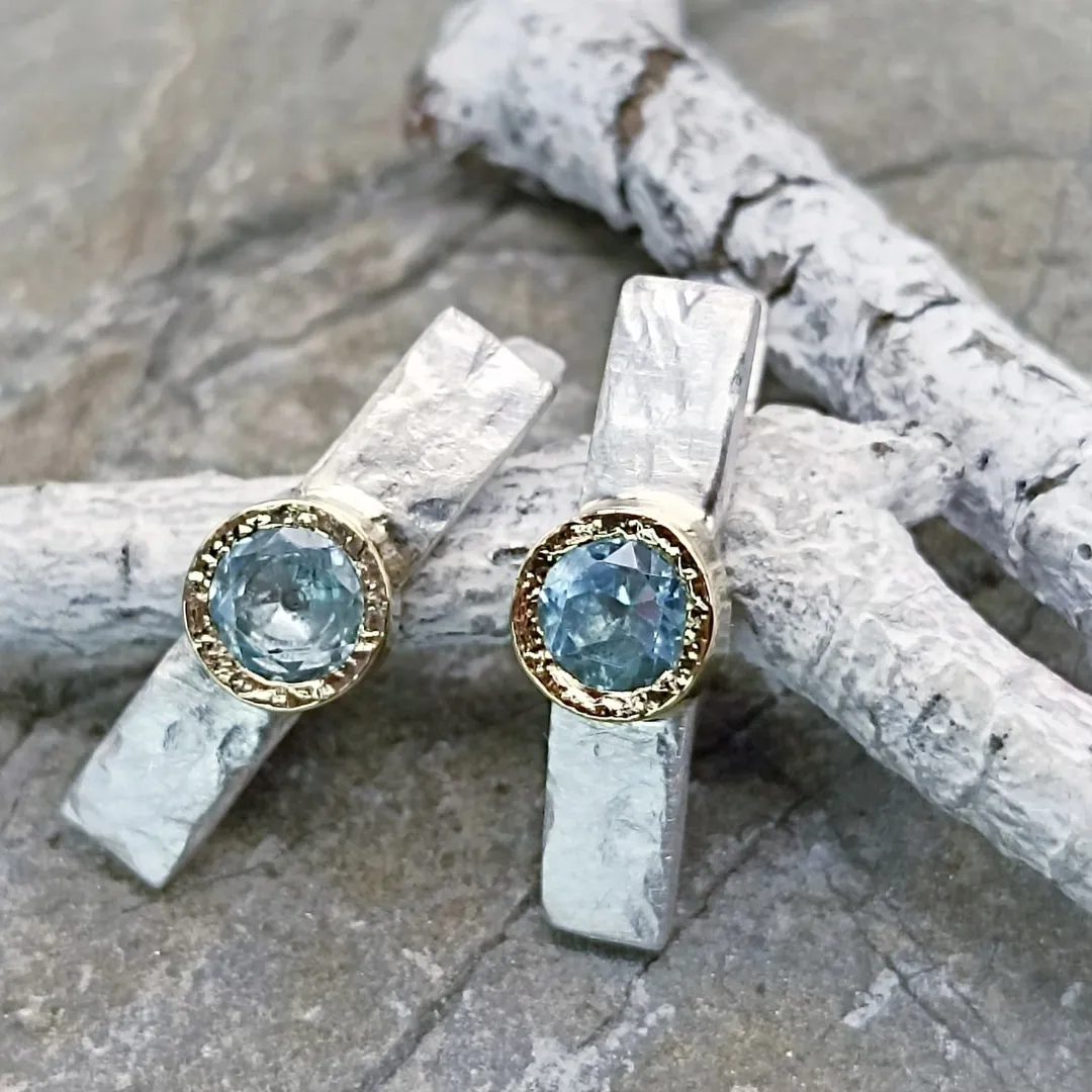 Gold and silver earrings with natural topazes