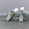 Gold and silver earrings with natural topazes