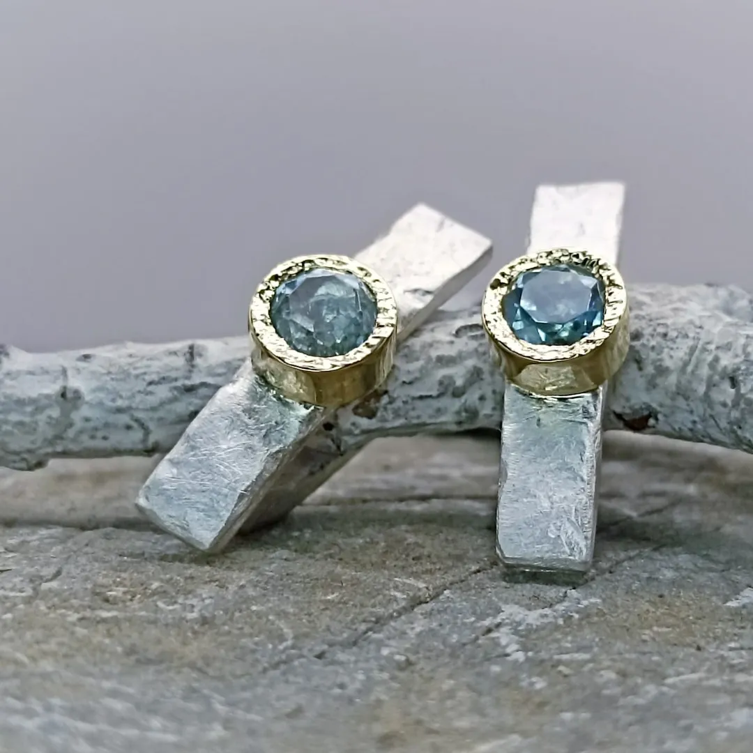 Gold and silver earrings with natural topazes