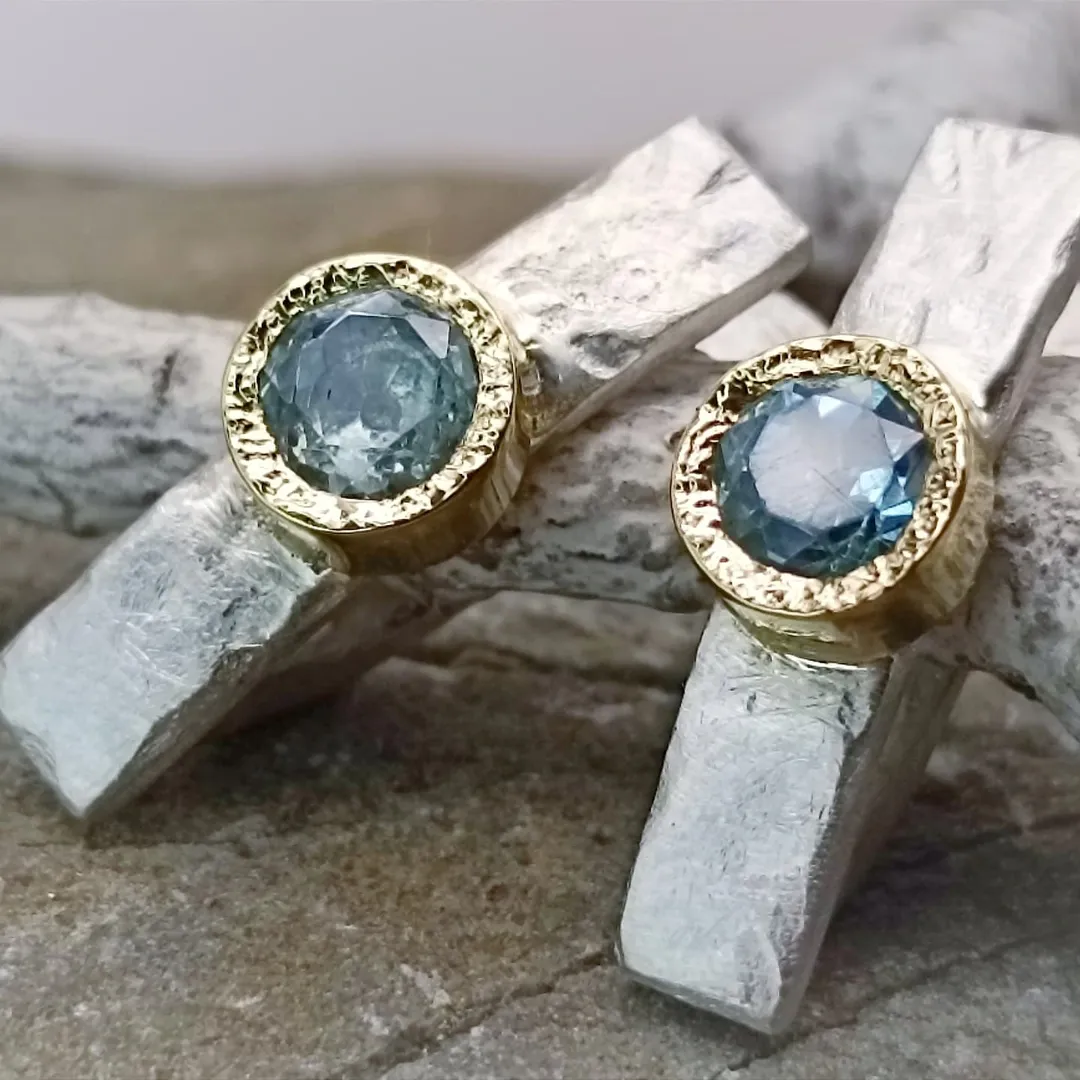 Gold and silver earrings with natural topazes