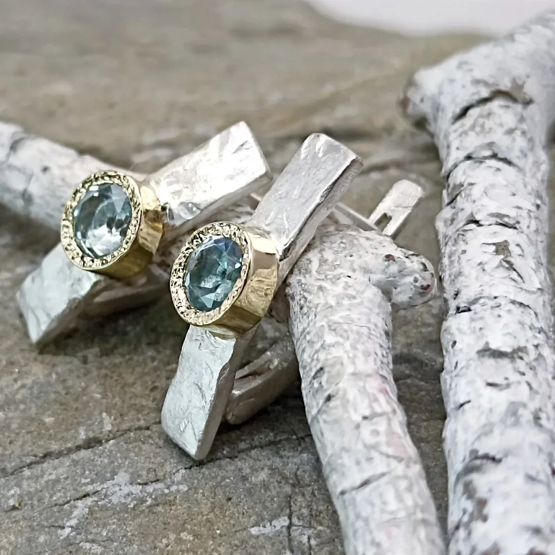 Gold and silver earrings with natural topazes