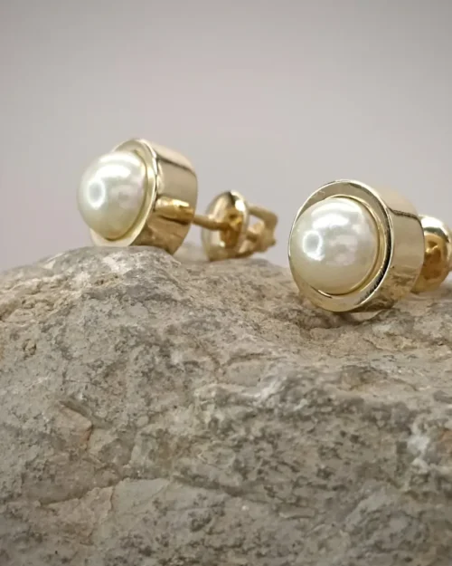 Earrings: natural pearls set in a gold