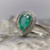 Golden ring with emerald and diamonds