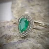 Golden ring with emerald and diamonds