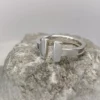 Ring "T"