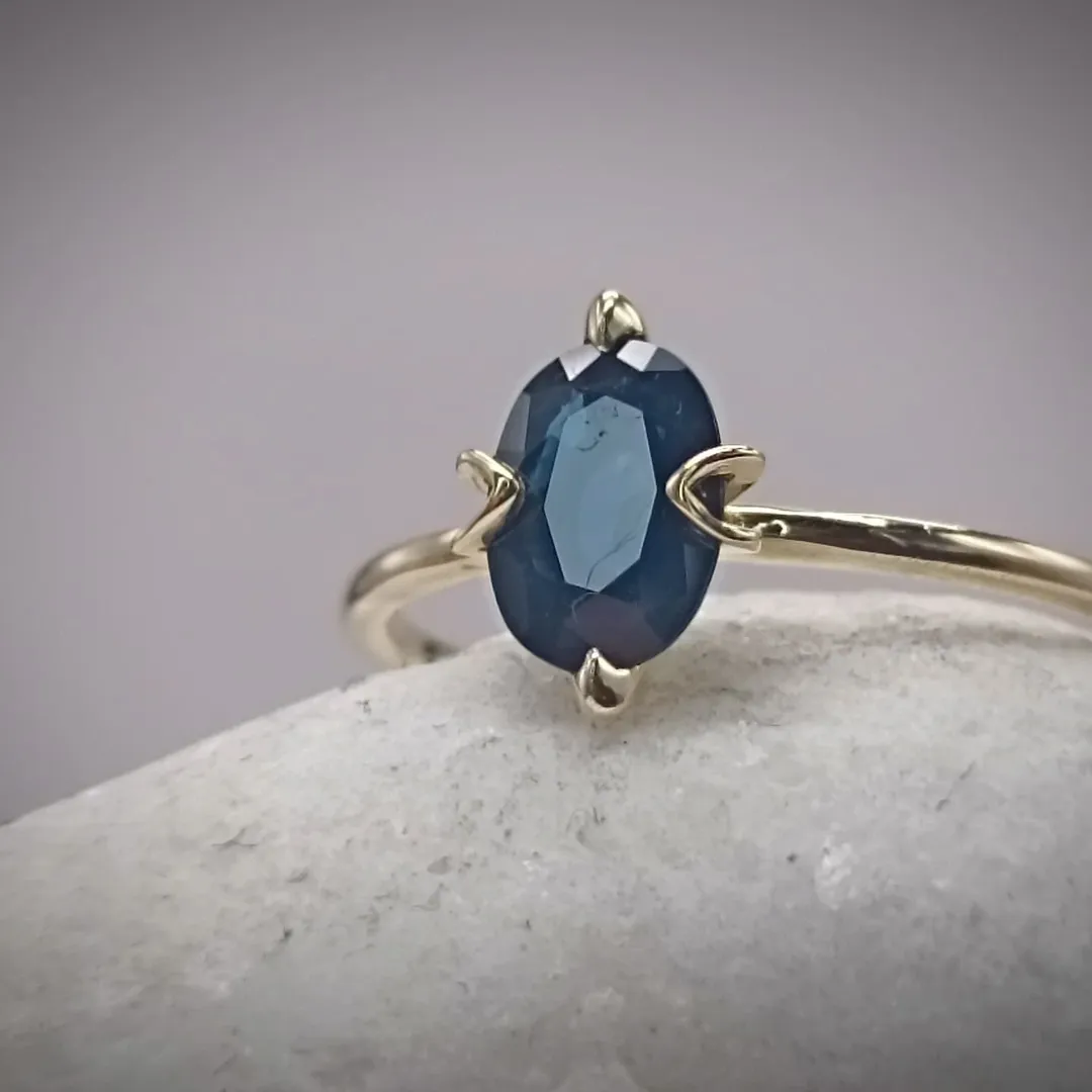 Golden ring with sapphire