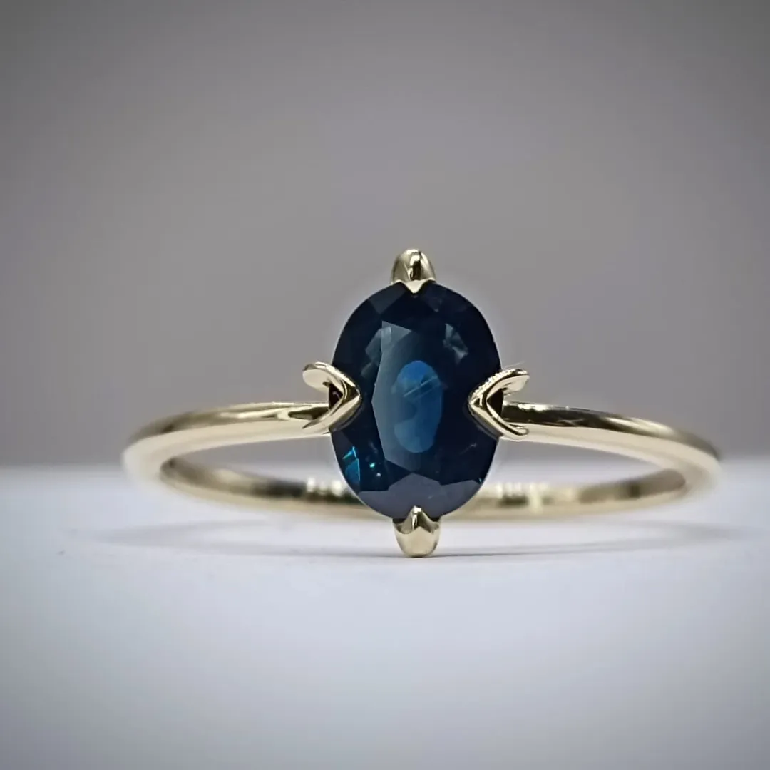 Golden ring with sapphire