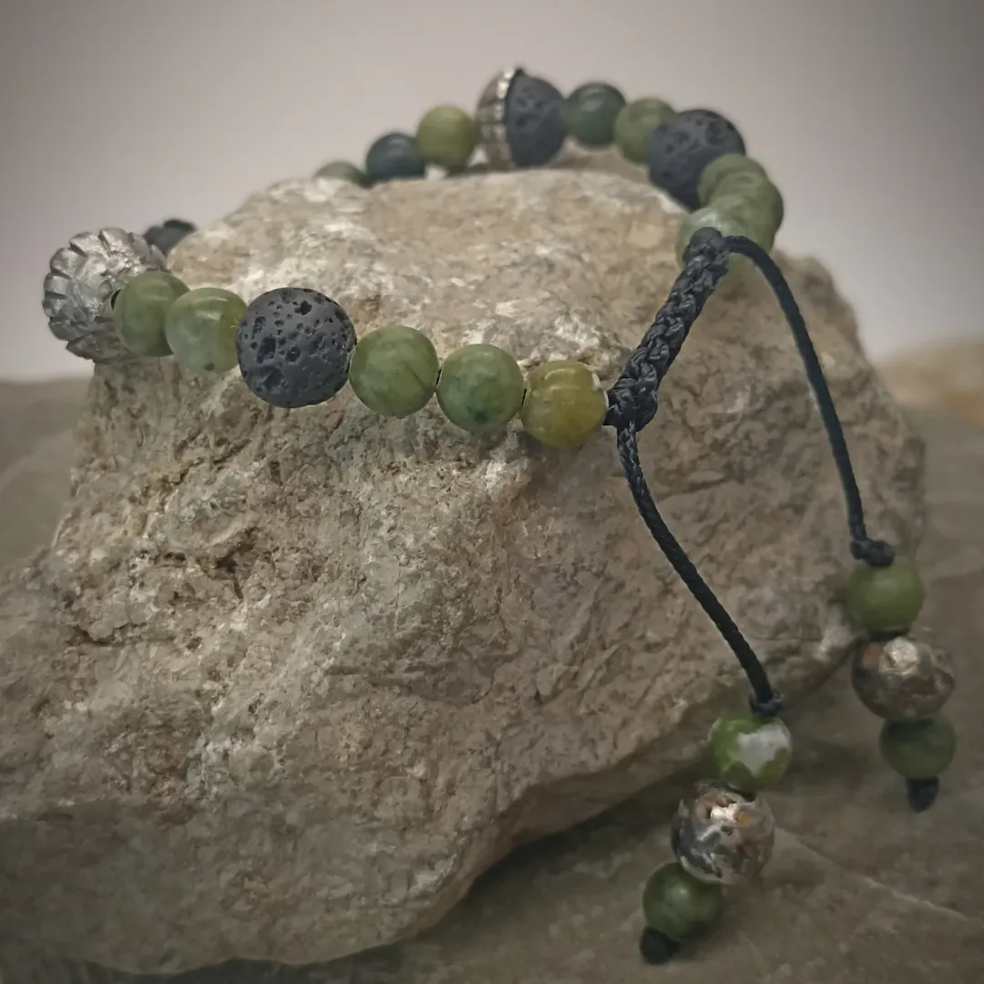 Bracelet with jade, volcanic stones, and silver inserts
